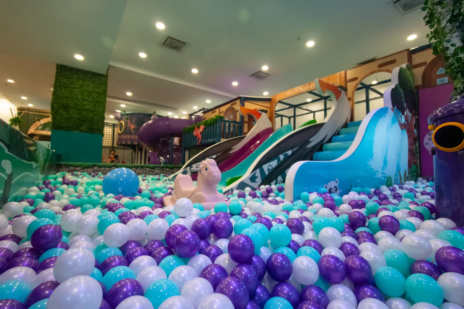 Wide ball pit with slides at Play Kingdoms indoor playground
